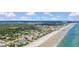 Wonderful oceanfront location featuring beach access, nearby community, and lush greenery at 2101 Hill St, New Smyrna Beach, FL 32169