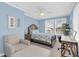 Bright bedroom with a full-size bed, and a dedicated workspace at 2101 Hill St, New Smyrna Beach, FL 32169