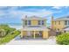 Charming yellow beach house with a covered front porch and ocean view at 2101 Hill St, New Smyrna Beach, FL 32169