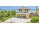 Beautiful yellow beach house with direct ocean access and spacious driveway at 2101 Hill St, New Smyrna Beach, FL 32169