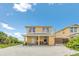Charming yellow beach house with covered front porch and a serene coastal setting at 2101 Hill St, New Smyrna Beach, FL 32169