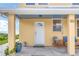Cozy front porch with seating area, perfect for enjoying the ocean breeze at 2101 Hill St, New Smyrna Beach, FL 32169
