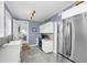 Modern kitchen with stainless steel fridge, white cabinets, and stylish countertops at 2101 Hill St, New Smyrna Beach, FL 32169