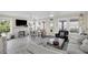 Spacious living room with fireplace, dining area, and ample natural light at 2101 Hill St, New Smyrna Beach, FL 32169