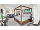 Spacious main bedroom features a four-poster bed and seating area at 2101 Hill St, New Smyrna Beach, FL 32169
