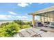 Expansive outdoor patio with ocean views, outdoor seating, and lush landscaping at 2101 Hill St, New Smyrna Beach, FL 32169