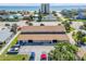 Aerial view of the neighborhood near the beach showing building roof and nearby parking area at 2122 S Atlantic Ave # 2122, New Smyrna Beach, FL 32169