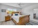 Bright bedroom featuring a wooden sleigh bed with white linens and nautical decor, creating a cozy coastal retreat at 2122 S Atlantic Ave # 2122, New Smyrna Beach, FL 32169