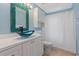 Stylish bathroom features a unique bowl sink, modern fixtures, and a shower with new white curtains at 223 Ne Golf Club Dr, New Smyrna Beach, FL 32168