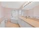 Clean bathroom with a tub, vanity, and tile flooring, offering a refreshing space at 223 Ne Golf Club Dr, New Smyrna Beach, FL 32168