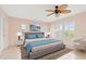 A cozy bedroom with shuttered windows, a ceiling fan, and carpet at 223 Ne Golf Club Dr, New Smyrna Beach, FL 32168