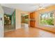 Cozy dining area with tile flooring, connecting to adjacent rooms and offering natural light at 223 Ne Golf Club Dr, New Smyrna Beach, FL 32168