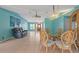 Bright open concept living and dining space has tile flooring throughout and views at 223 Ne Golf Club Dr, New Smyrna Beach, FL 32168