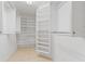Spacious walk-in closet with built-in shelving and ample storage space for an organized wardrobe at 223 Ne Golf Club Dr, New Smyrna Beach, FL 32168
