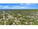 Aerial view of home surrounded by mature trees in residential neighborhood at 2325 Lime Tree Dr, Edgewater, FL 32141