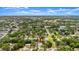 Aerial view of home in residential area surrounded by lush greenery at 2325 Lime Tree Dr, Edgewater, FL 32141