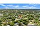 Aerial view of home and neighborhood with mature trees at 2325 Lime Tree Dr, Edgewater, FL 32141