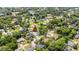 Aerial view of home surrounded by mature trees in quiet neighborhood at 2325 Lime Tree Dr, Edgewater, FL 32141