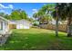 The home has a spacious backyard with a fence and a shed at 2325 Lime Tree Dr, Edgewater, FL 32141