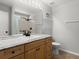 This bright bathroom has a granite countertop vanity and updated fixtures at 2325 Lime Tree Dr, Edgewater, FL 32141