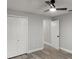 Bedroom boasting wood-look floors, a ceiling fan, and spacious double closets at 2325 Lime Tree Dr, Edgewater, FL 32141