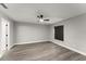 Bright bedroom features sleek wood-look floors and a modern ceiling fan at 2325 Lime Tree Dr, Edgewater, FL 32141