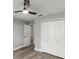 Bedroom featuring a ceiling fan, wood-look floors, and a large closet at 2325 Lime Tree Dr, Edgewater, FL 32141