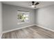 This light-filled room features stylish wood-look floors and a sunlit window at 2325 Lime Tree Dr, Edgewater, FL 32141