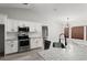 Modern kitchen featuring stainless steel appliances, granite countertops, and ample cabinet space, creating a chef's paradise at 2325 Lime Tree Dr, Edgewater, FL 32141