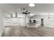 Open-concept living space with sleek floors, stylish lighting, and seamless flow throughout the home at 2325 Lime Tree Dr, Edgewater, FL 32141