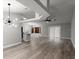 Bright, open-concept living area with new flooring, modern lighting, and seamless flow to the kitchen, perfect for entertaining at 2325 Lime Tree Dr, Edgewater, FL 32141