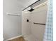 The walk-in shower boasts updated fixtures and a grab bar at 2325 Lime Tree Dr, Edgewater, FL 32141