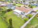 Aerial view of the home's roof, backyard, patio, green grass, and surrounding neighborhood at 25 Dolphin Ave, Ormond Beach, FL 32176