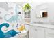 Bright bathroom with a dinosaur-themed shower curtain and modern sink with a vanity at 25 Dolphin Ave, Ormond Beach, FL 32176
