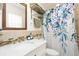 Beautiful bathroom with floral shower curtain, vanity sink, and towel rack at 25 Dolphin Ave, Ormond Beach, FL 32176