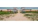 Path to Ormond Beach Plaza with an ocean view. A picturesque beach access point in a scenic location at 25 Dolphin Ave, Ormond Beach, FL 32176
