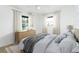Serene bedroom with soft natural light, neutral tones, and a comfortable king-sized bed at 25 Dolphin Ave, Ormond Beach, FL 32176