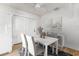 Bright dining area with white walls, modern furniture, and plenty of natural light from a nearby window at 25 Dolphin Ave, Ormond Beach, FL 32176