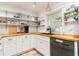 Charming kitchen with open shelving, butcher block countertops, and modern appliances at 25 Dolphin Ave, Ormond Beach, FL 32176