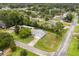 This aerial shows the roof, established neighborhood, landscaping, and access to local roads and amenities at 2529 Umbrella Tree Dr, Edgewater, FL 32141