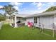 Well maintained backyard featuring an outdoor lounge space and artificial turf at 2529 Umbrella Tree Dr, Edgewater, FL 32141