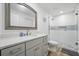 Modern bathroom features a glass enclosed shower and gray vanity with countertop at 2529 Umbrella Tree Dr, Edgewater, FL 32141