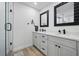 Bathroom boasts double vanity with modern hardware, and a glass enclosed shower with luxury fixtures at 2529 Umbrella Tree Dr, Edgewater, FL 32141