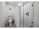 Contemporary bathroom with a glass shower stall, toilet, and tiled floors, maximizing space and functionality at 2529 Umbrella Tree Dr, Edgewater, FL 32141