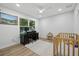 Bright office area with a window, desk, and a crib, balancing work and Gathering life at 2529 Umbrella Tree Dr, Edgewater, FL 32141