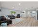 Spacious living room features a comfortable sofa and lots of natural light at 2529 Umbrella Tree Dr, Edgewater, FL 32141