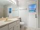 This bathroom has a mirror, sink, and toilet at 2628 Vista Palm Dr, Edgewater, FL 32141