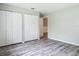 A spacious bedroom with wood-look flooring and double door closet at 2628 Vista Palm Dr, Edgewater, FL 32141