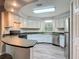 Well-lit kitchen with stainless steel appliances, breakfast bar, and updated fixtures at 2628 Vista Palm Dr, Edgewater, FL 32141
