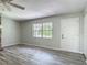 Comfortable space with wood-look floors, stone fireplace, and natural light at 2628 Vista Palm Dr, Edgewater, FL 32141